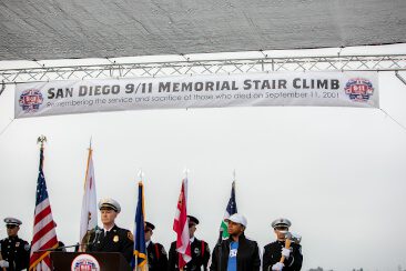 Military personnel standing on stage at the San Diego 9/11 Memorial Stair Climb.